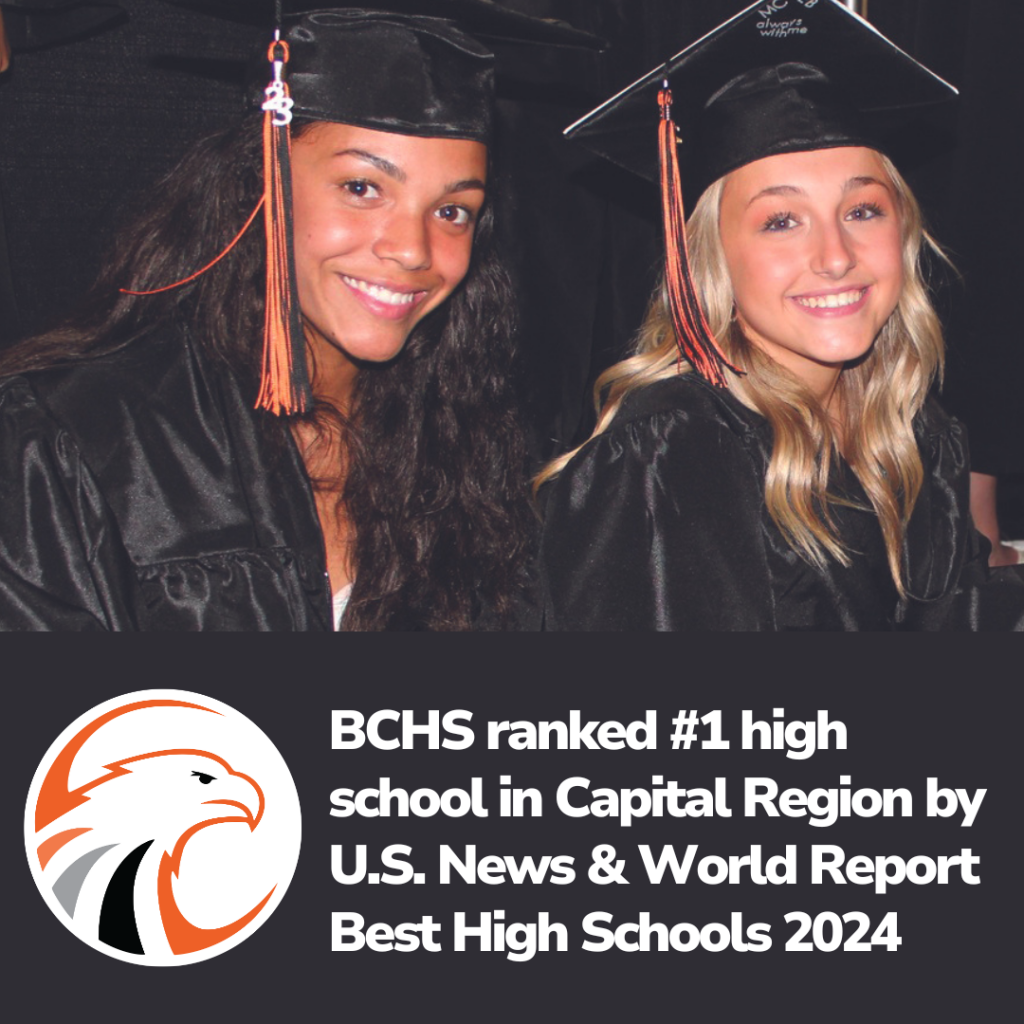 two students in caps and gowns