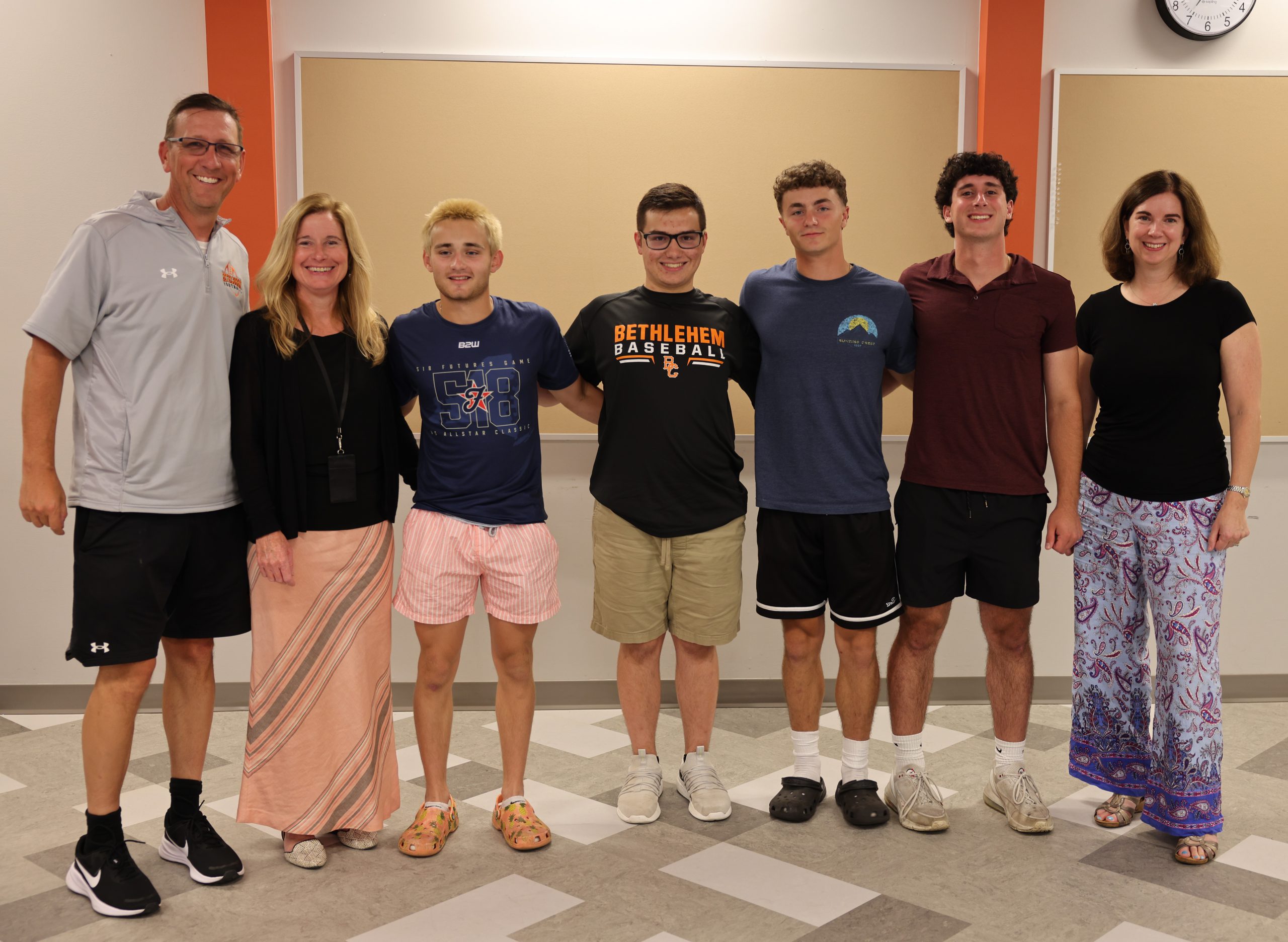 Superintendent Jody Monroe and Board President Holly Dellenbaugh pictured with members of the BC boys baseball team and Coach Rick Leach.