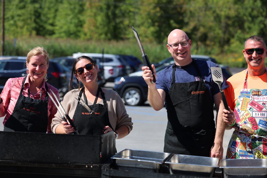 people holding grill items