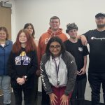 students and teachers pose for photo