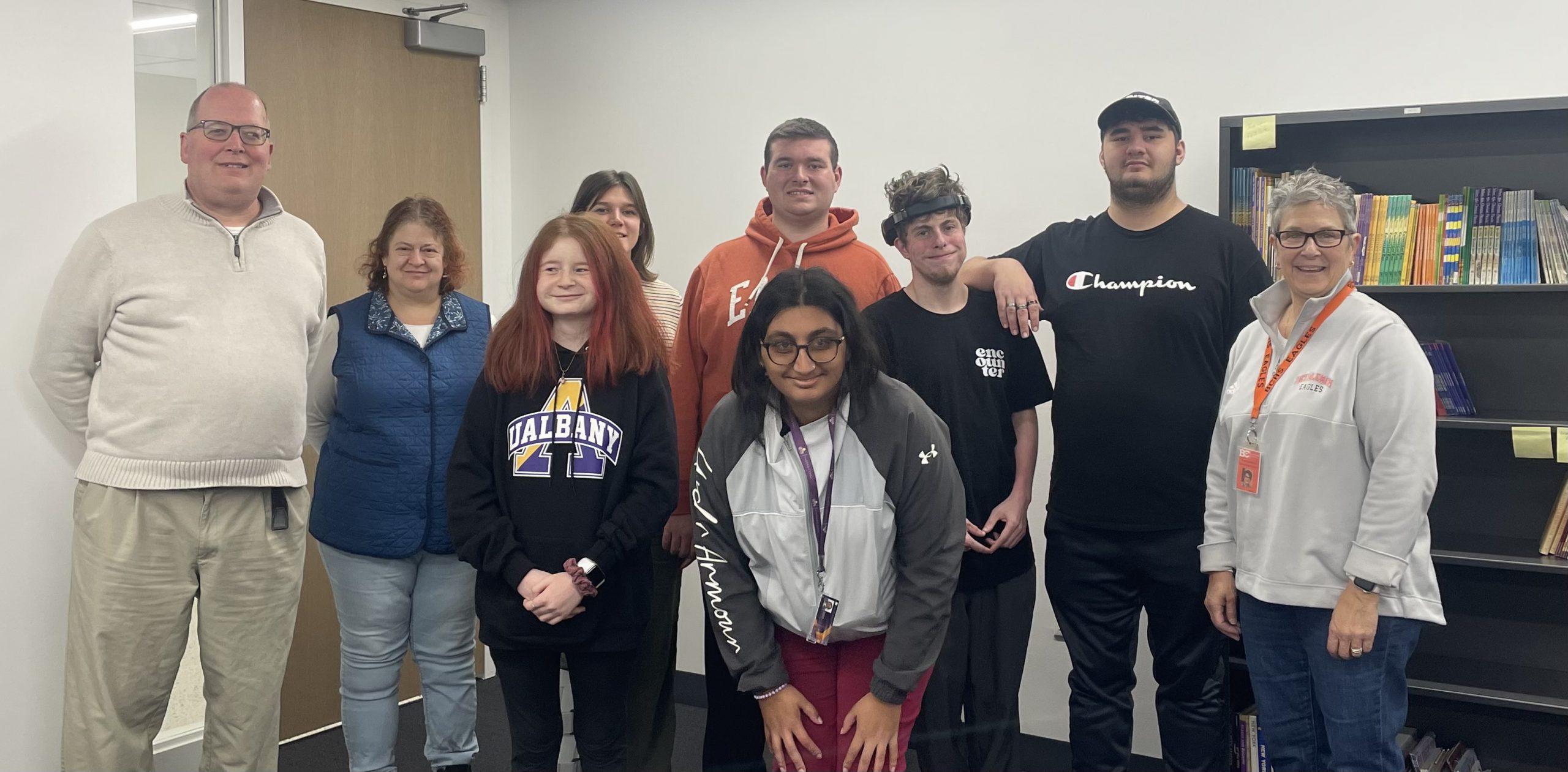 students and teachers pose for photo