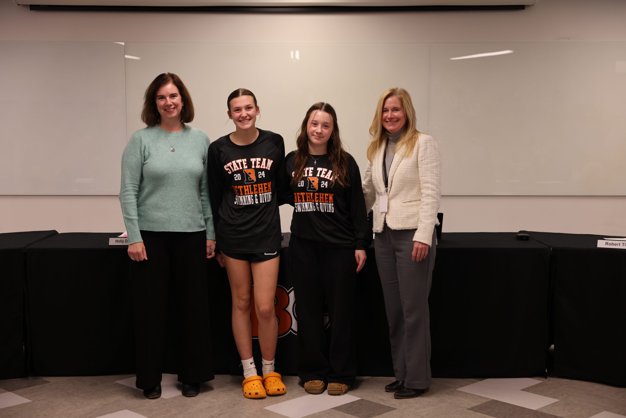 Photograph of Superintendent Jody Monroe, Board of Education President Holly Dellenbaugh and BC dive team members Ellie Danz and Natalie Hopper