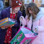 students looking at gifts