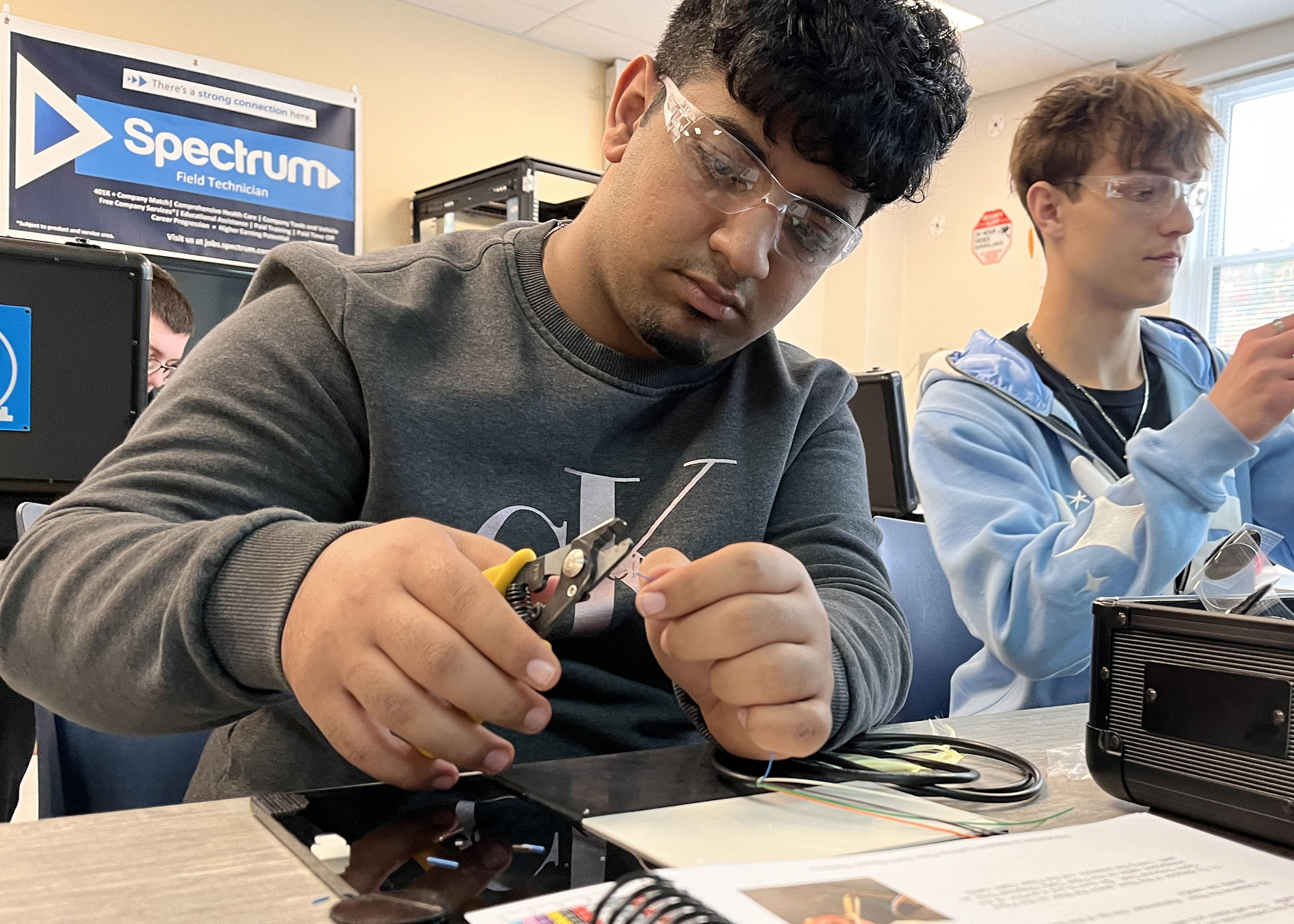 student holding tools