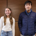 two students pose for photo